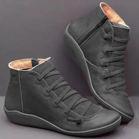 Women's casual flat ankle boots with wedge heel and round toe in leopard print colour.