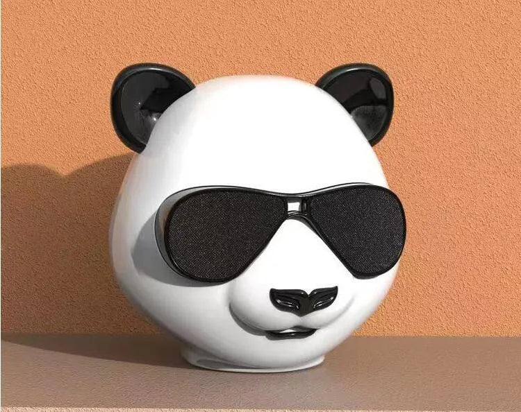 Classic style portable mini Bluetooth speaker shown with USB charging cable
