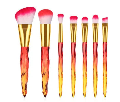 Ten clear crystal-handled foundation brushes with artificial fibre bristles in black, blue, red, and yellow colours