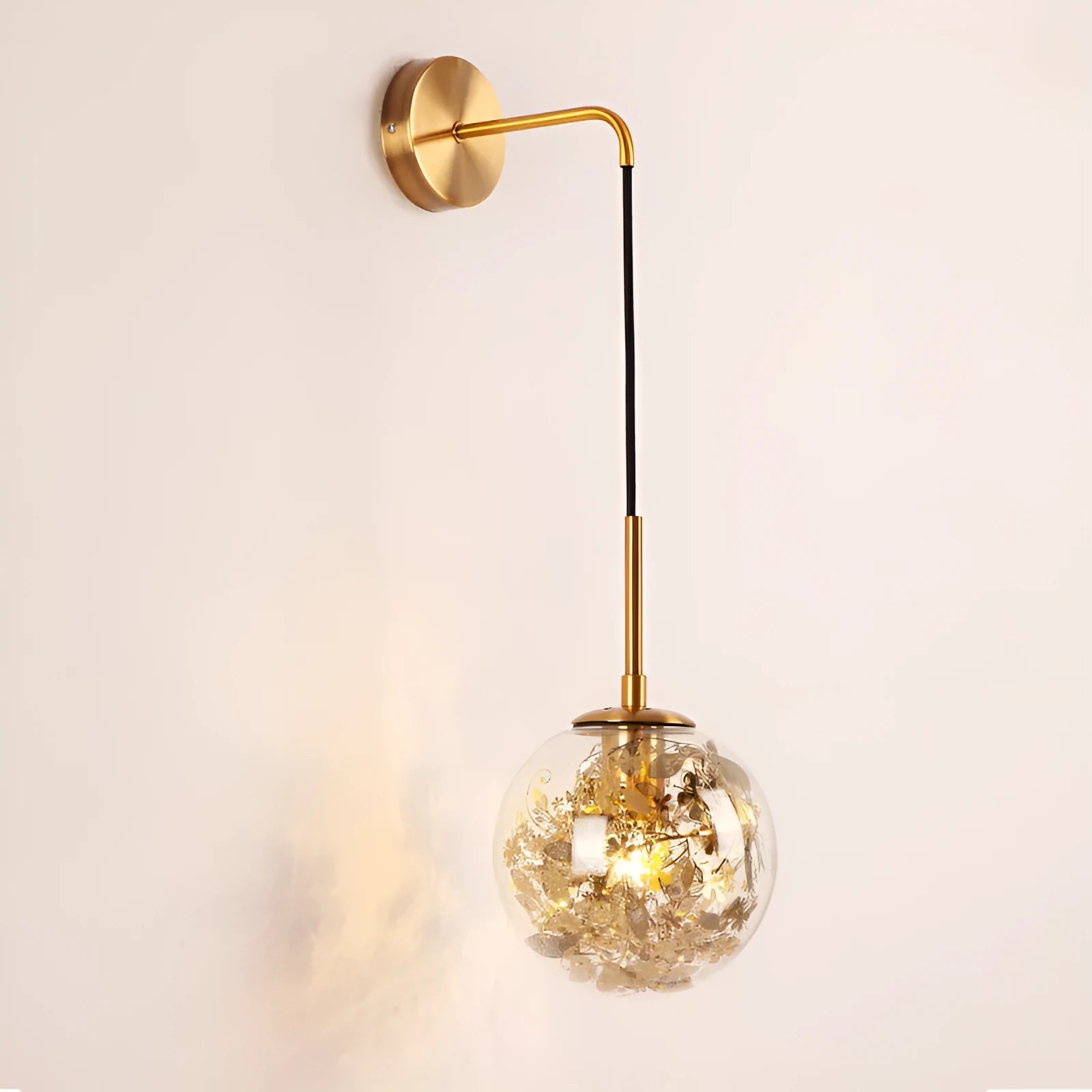 Modern glass wall lamp with golden flower pattern, 20cm size, emitting warm LED light.