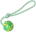 Natural rubber dog ball attached to a nylon rope for fetch and tug games.