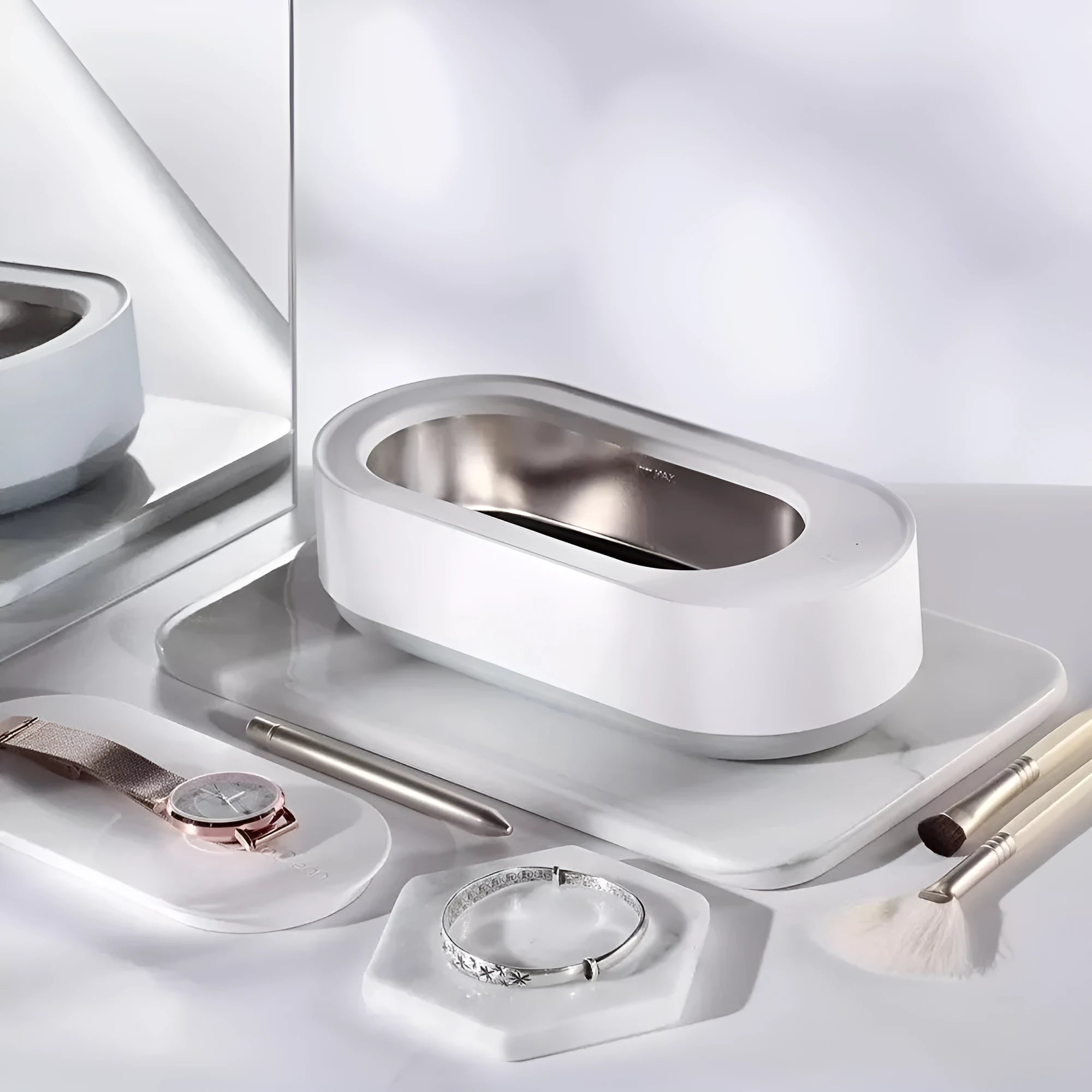White portable ultrasonic cleaner with digital display and stainless steel cleaning tank.