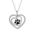 Close-up of a women's copper necklace with a heart-shaped dog's paw print pendant.