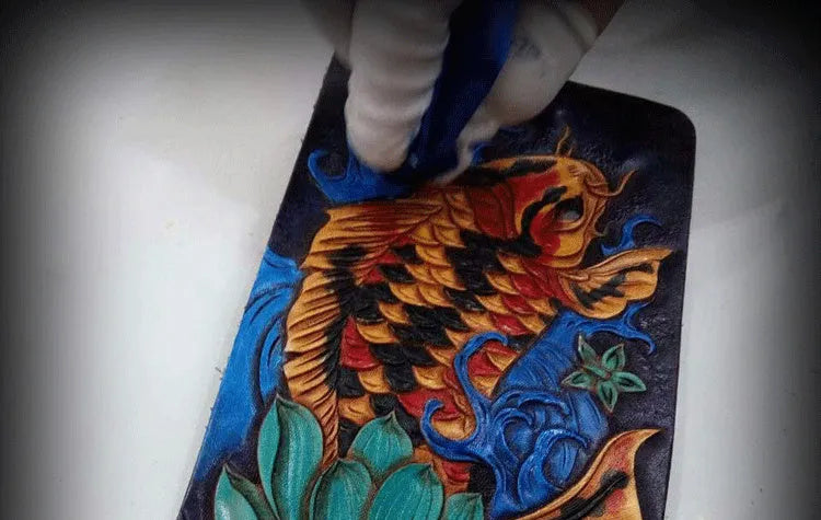 Hand-carved genuine cowhide leather short wallet in red blue gold colours showing open closure