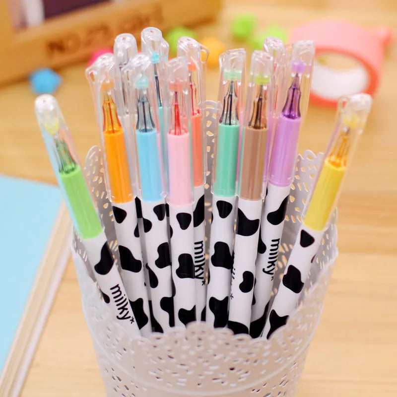Box of twelve cow pattern gel pens with 0.38mm tips in assorted colours.
