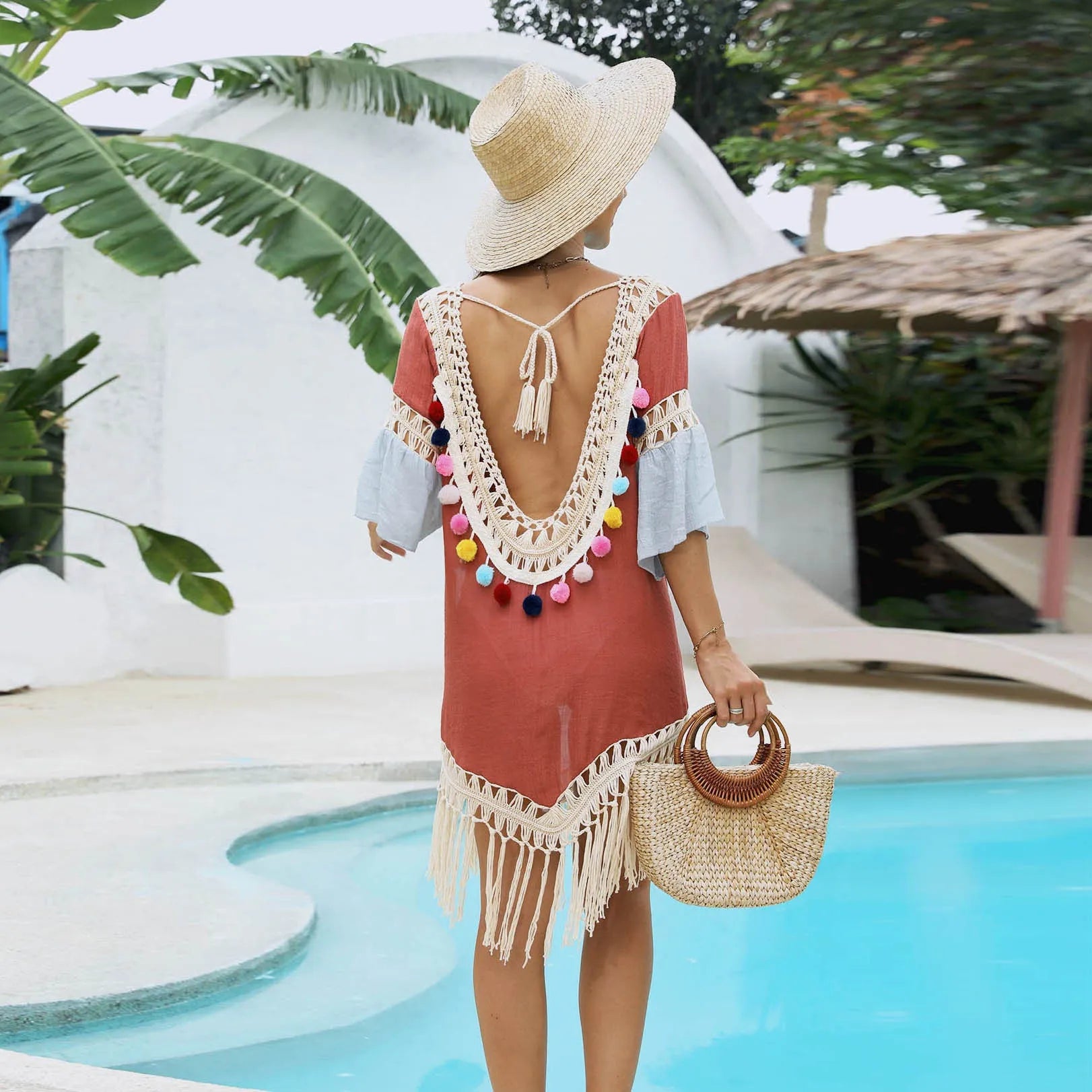 Orange floral beach overskirt with hand crochet tassels, shown as a free-size cover-up.