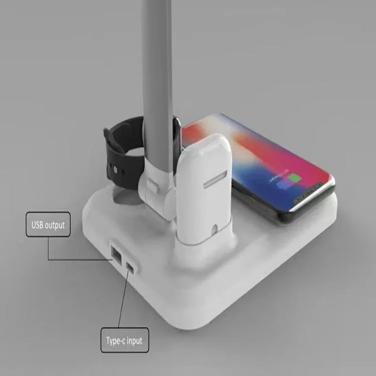 Black 4-in-1 LED desk lamp with adjustable arm and wireless charging pad for mobile phones