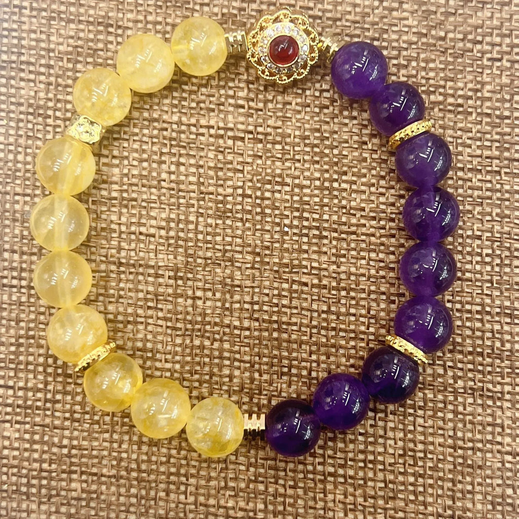Handmade women's yellow and purple amethyst crystal bracelet showing manual craftsmanship details