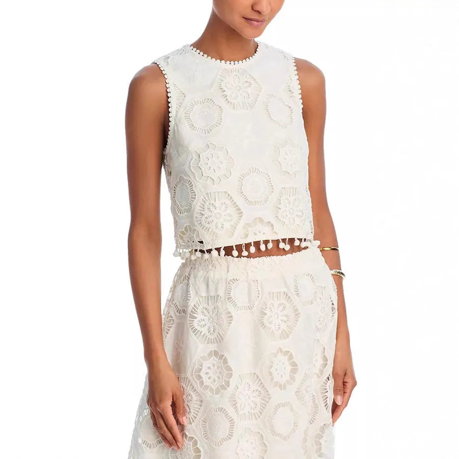 White women's sleeveless top and long skirt suit set with embroidery detailing