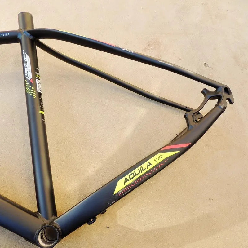 Black green aluminium 29-inch mountain bike frame showing innerline routing and disc brake mounts