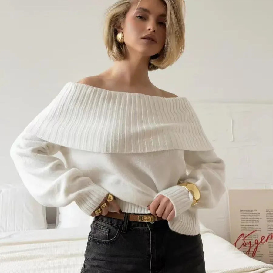 Grey off-the-shoulder strapless pullover sweater with a 3D pattern on a model.