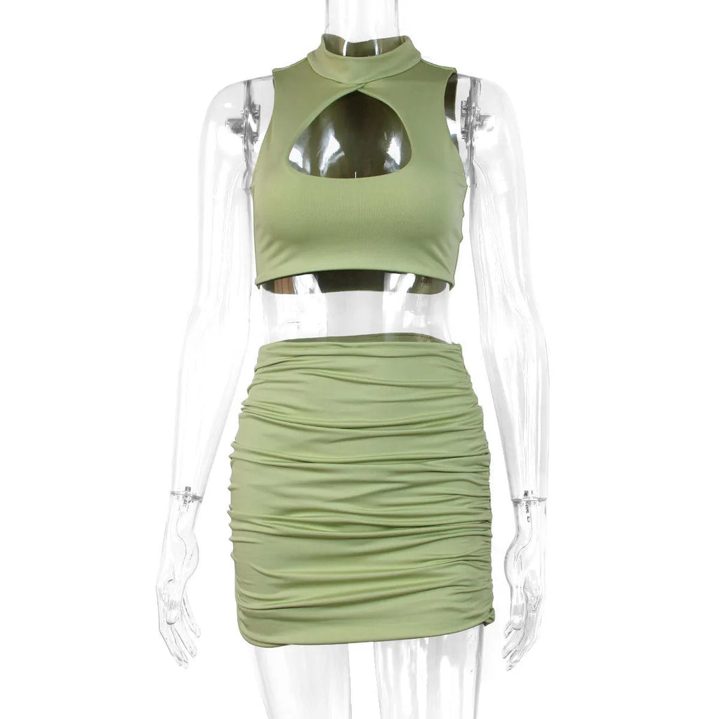 Light purple women's two-piece set with hollow vest top and matching hip skirt