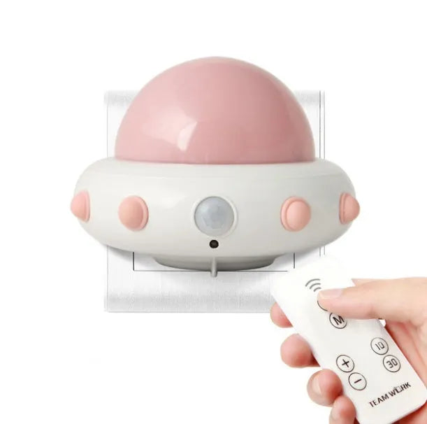 Remote control UFO-shaped bedside night light in blue, pink, or white with LED lighting
