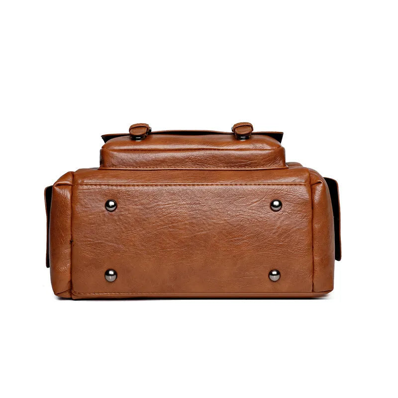 Large vintage messenger bag in horizontal square shape with contrast stitching, shown in available colour options