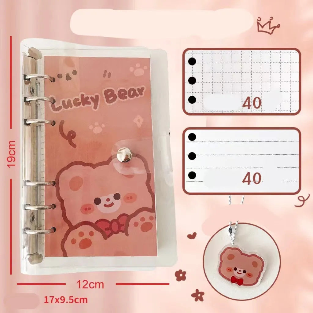 A6 size loose-leaf coil notebook with heart-themed bear design, showing coil binding and 6-hole edge.