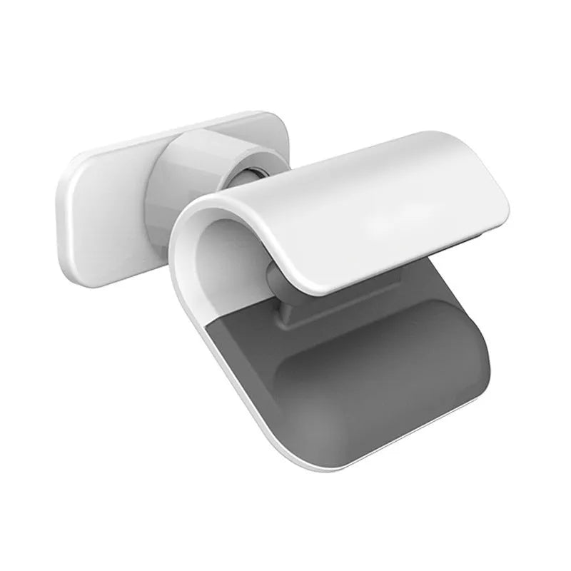 Black gravity car phone holder with adhesive mount, showing 360-degree rotation mechanism.