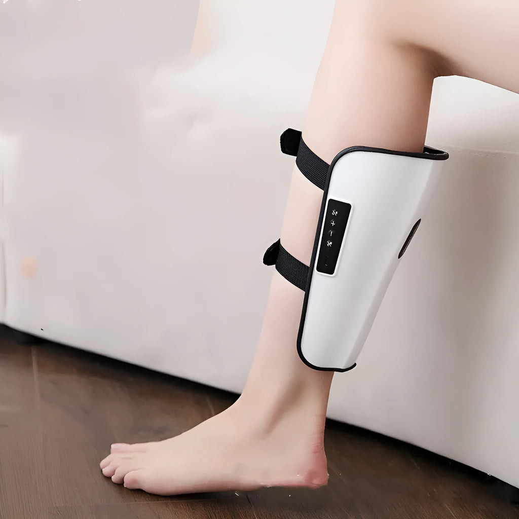 White plastic calf massager with mechanical controls for infrared and electrotherapy pulse functions.