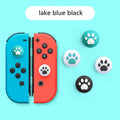 Set of four silicone cat claw grip covers for Nintendo Switch Lite joysticks in assorted colours.