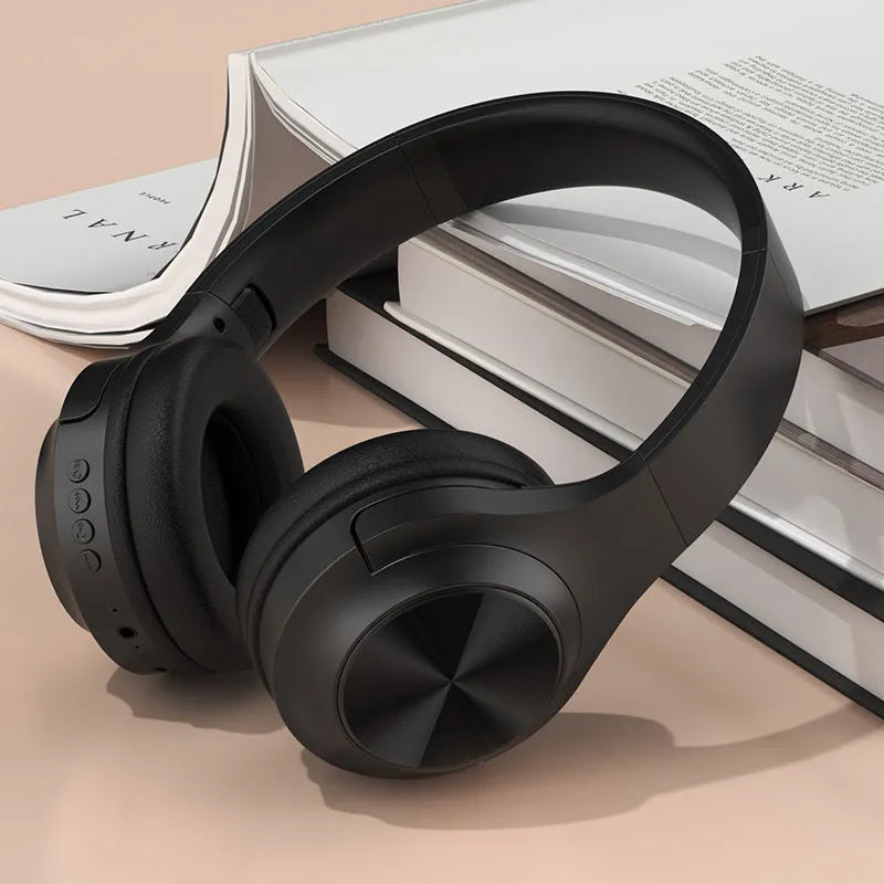 Wireless Bluetooth over-ear headset in ivory white colour with creative design and charging case