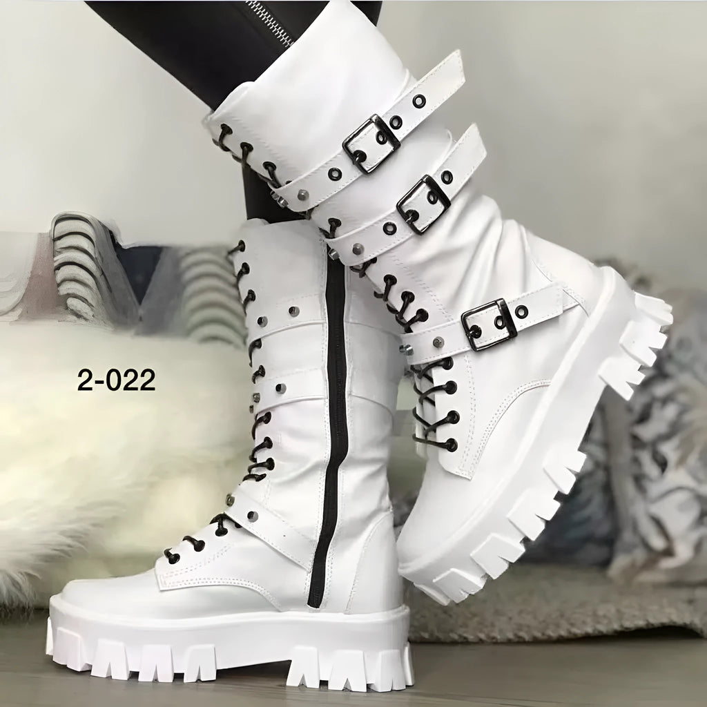 Women's black mid-calf knight boots with a metal buckle and side zipper on a chunky sole.