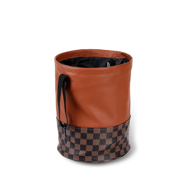 Retractable leather car trash can with waterproof lining and carry handle shown in vehicle