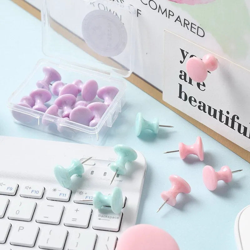 Assortment of plastic push pins in cherry blossom pink, mint green, and lavender, showing large and small sizes.