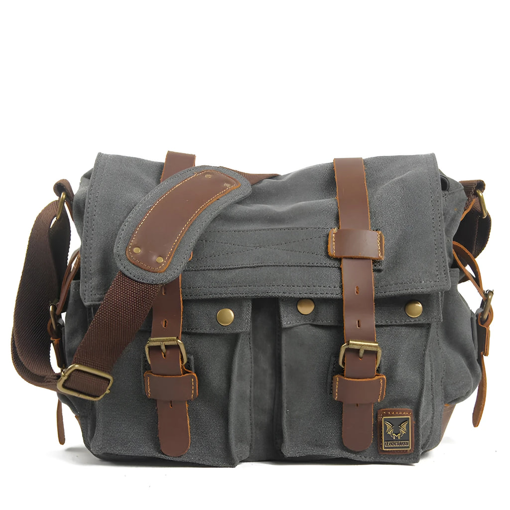 Men's canvas crossbody shoulder bag with cowhide trim showing internal organisers
