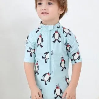 Boy's penguin themed long sleeve swimsuit with matching swimming cap for sun protection