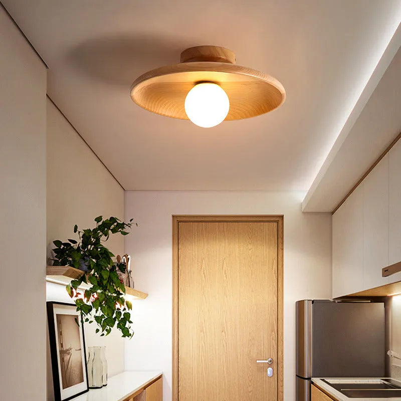 Solid wood ring ceiling lamp with glass shade in modern minimalist design.
