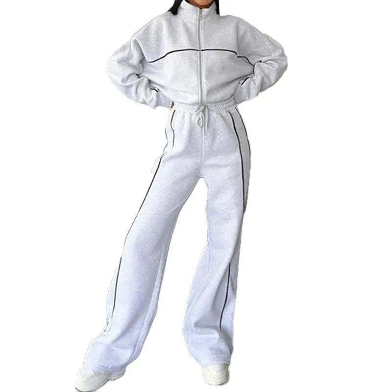 Casual polyester suit with zip hoodie and striped lace-up trousers in apricot colour.