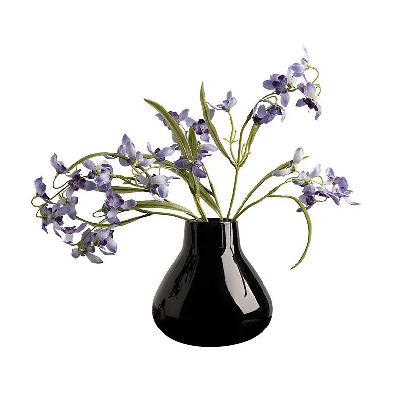 Ceramic round belly French style vase in black with two artificial white orchid flowers