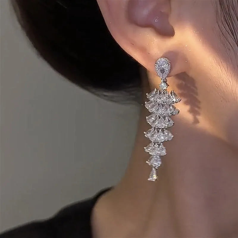 Silver pagoda Christmas tree drop earrings with sparkling zircon detail on copper studs.