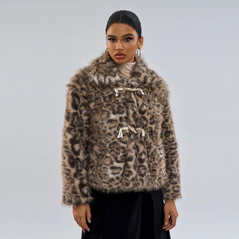 Women's leopard print coat with buckle lapel closure showing regular sleeves and normal length