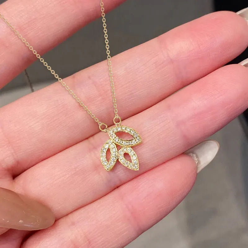 Women's yellow gold copper hollow leaf horse eye pendant necklace with inlaid zircon on adjustable O-ring chain