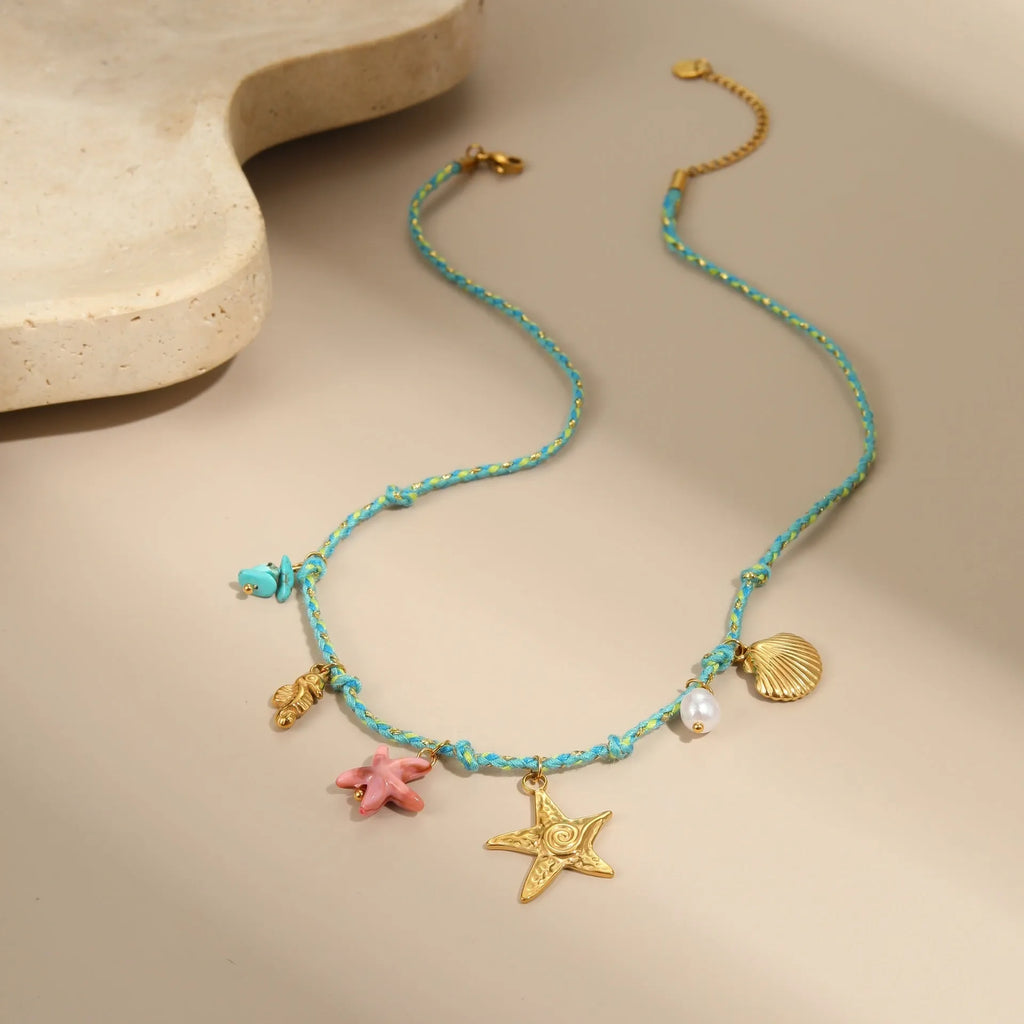 Handmade colour braided rope and stainless steel necklace with heart-shaped pendant on adjustable chain.