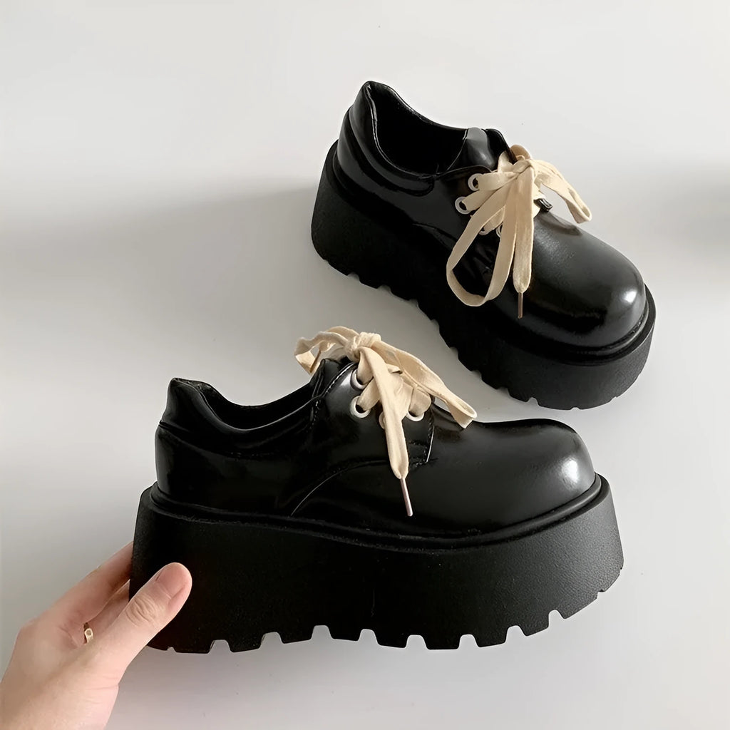 Matte black women's lace-up platform heels with chunky 6-8cm sole and round toe.