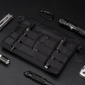 Black Oxford cloth military-style outdoor tactical bag, compact size.
