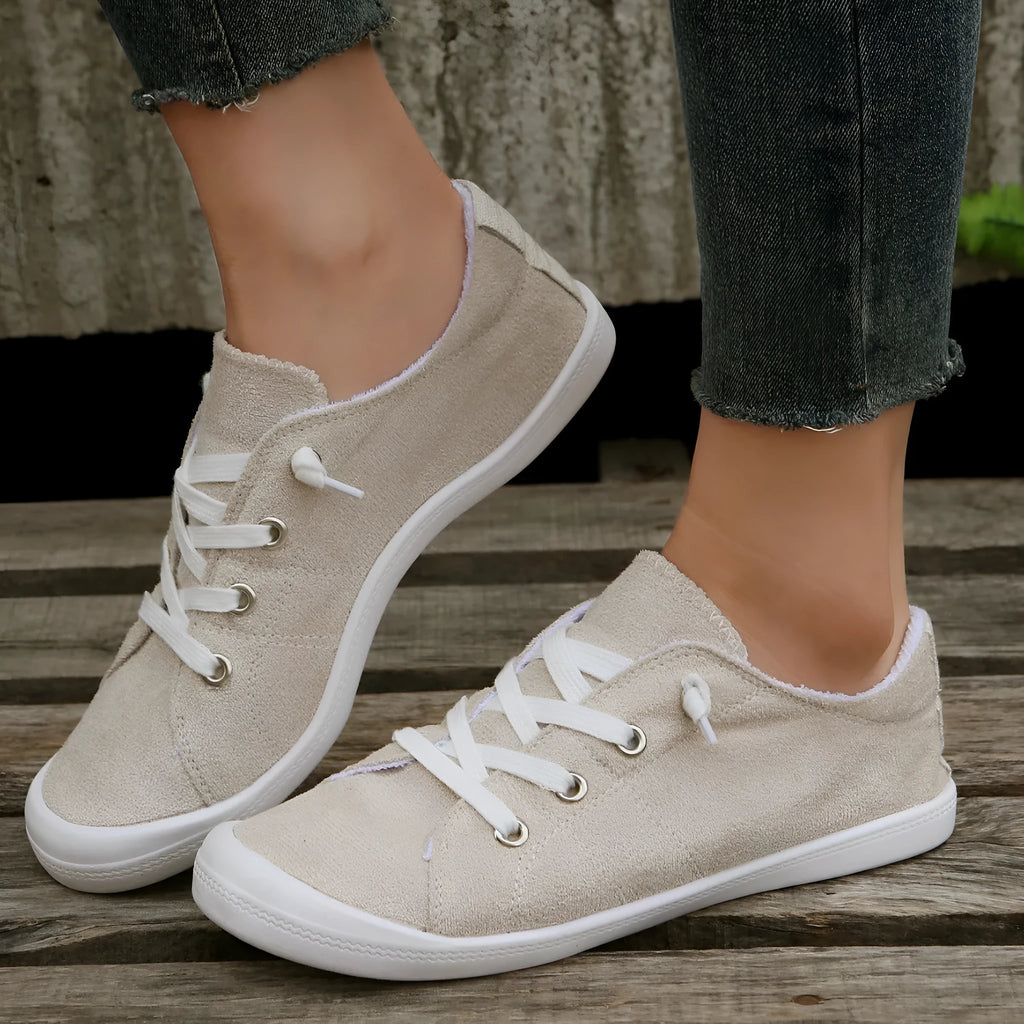 Women's creamy white low-top fabric casual sneaker on a wear-resistant rubber sole