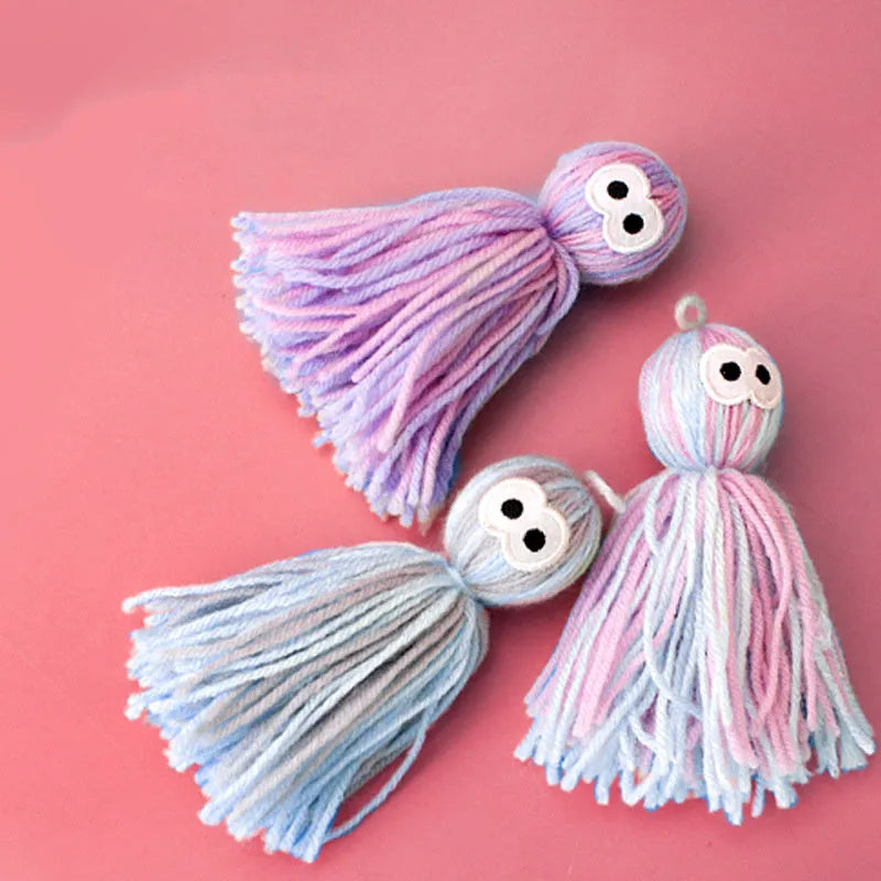 Bite-resistant wool cat ball toy in blue-grey, pink and blue, or pink and purple colour options.
