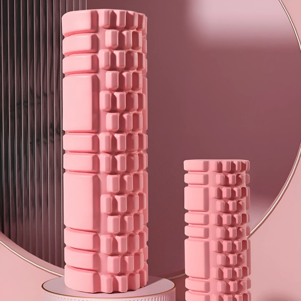A cylindrical EVA foam roller for fitness recovery, shown in a choice of colours including pink, blue, and grey.