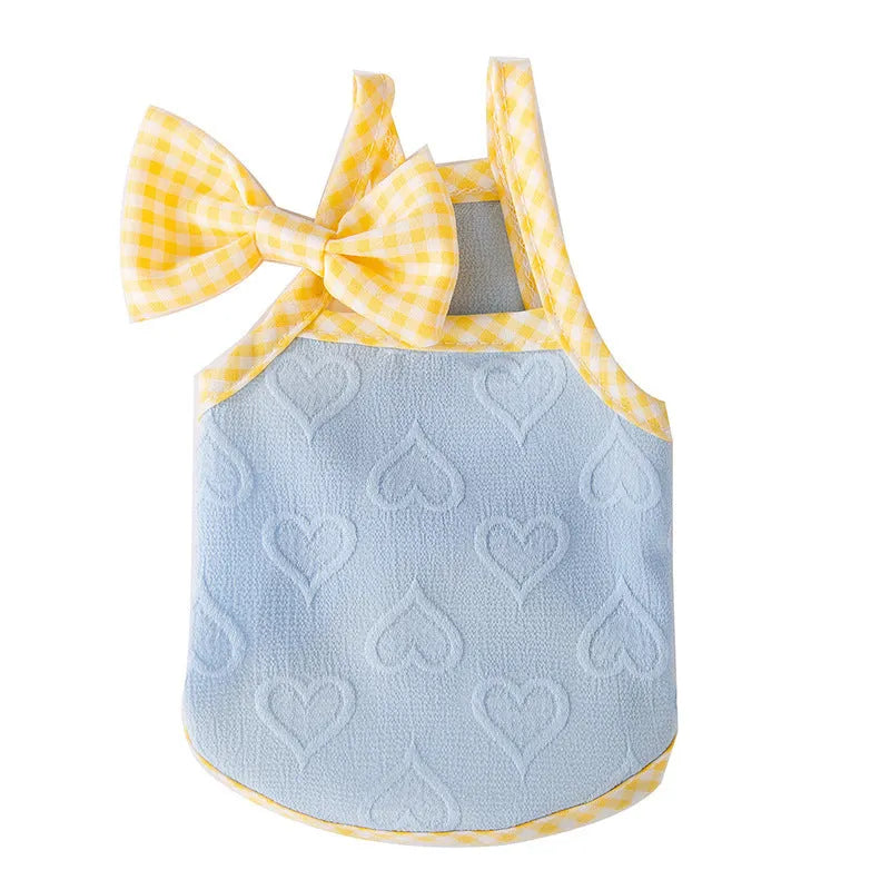 Small dog wearing elastic suspenders vest with heart relief bow in Bondi Blue colour