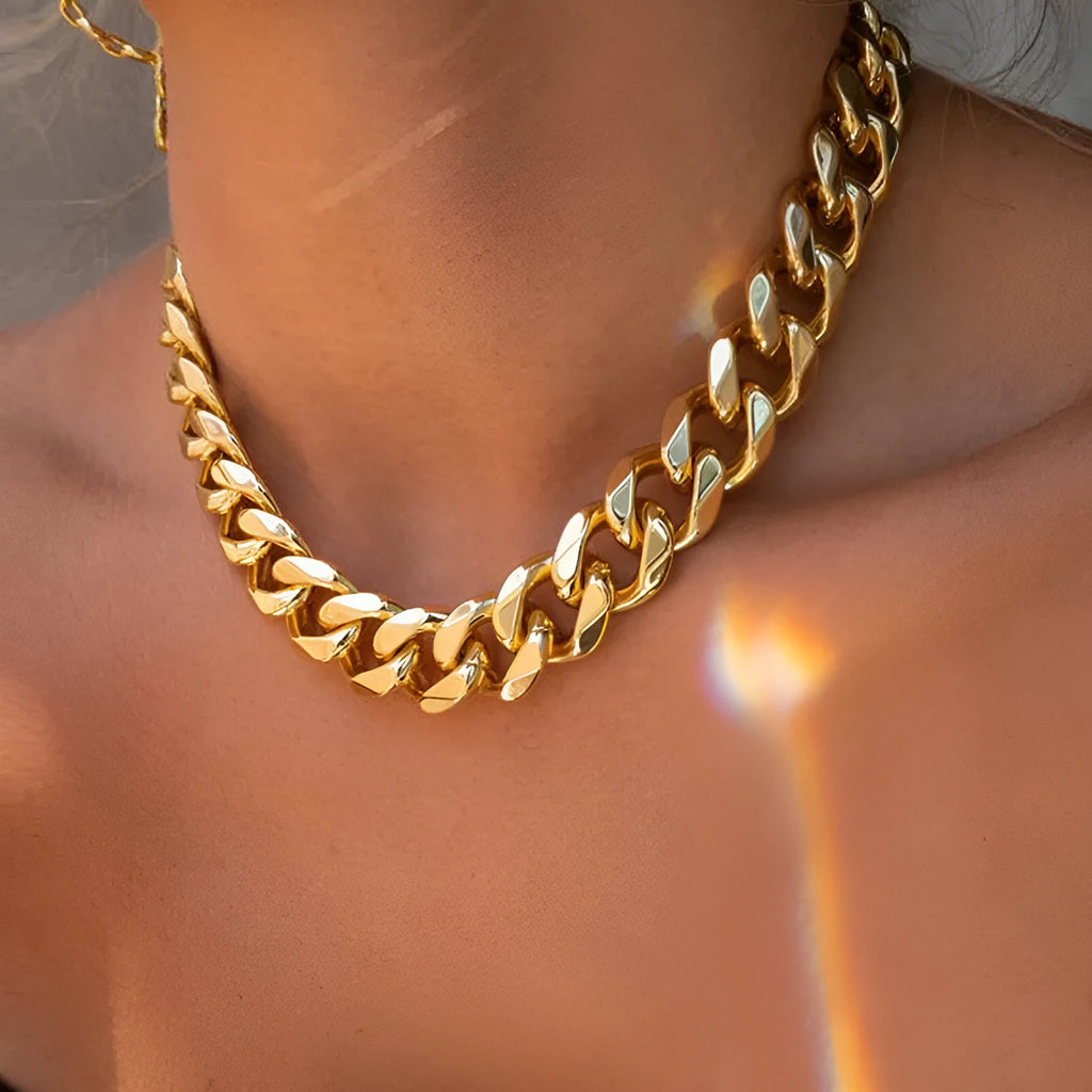 Gold women's thick chain alloy necklace measuring 32cm long and 6cm wide.