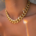 Gold women's thick chain alloy necklace measuring 32cm long and 6cm wide.
