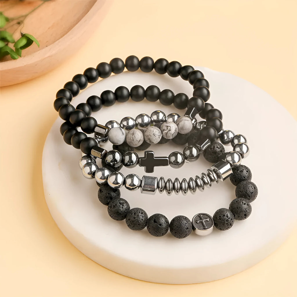Geometric volcanic rock agate bracelet with stainless steel finish on a wrist.