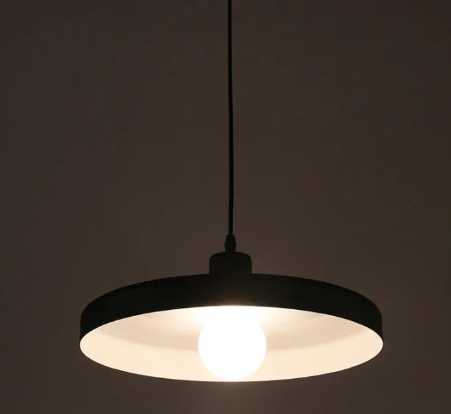 Aluminium alloy pendant chandelier light fitting in black, shown in a restaurant setting.