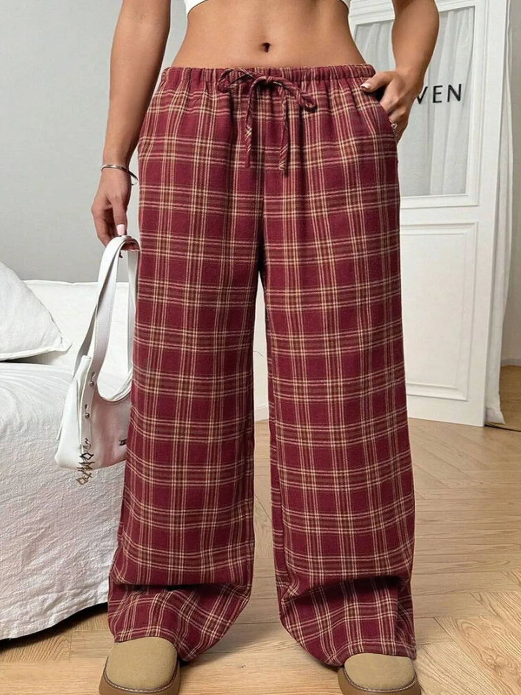 Women's loose-fit plaid trousers with drawstring waist and side pockets in blue or red