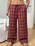 Women's loose-fit plaid trousers with drawstring waist and side pockets in blue or red