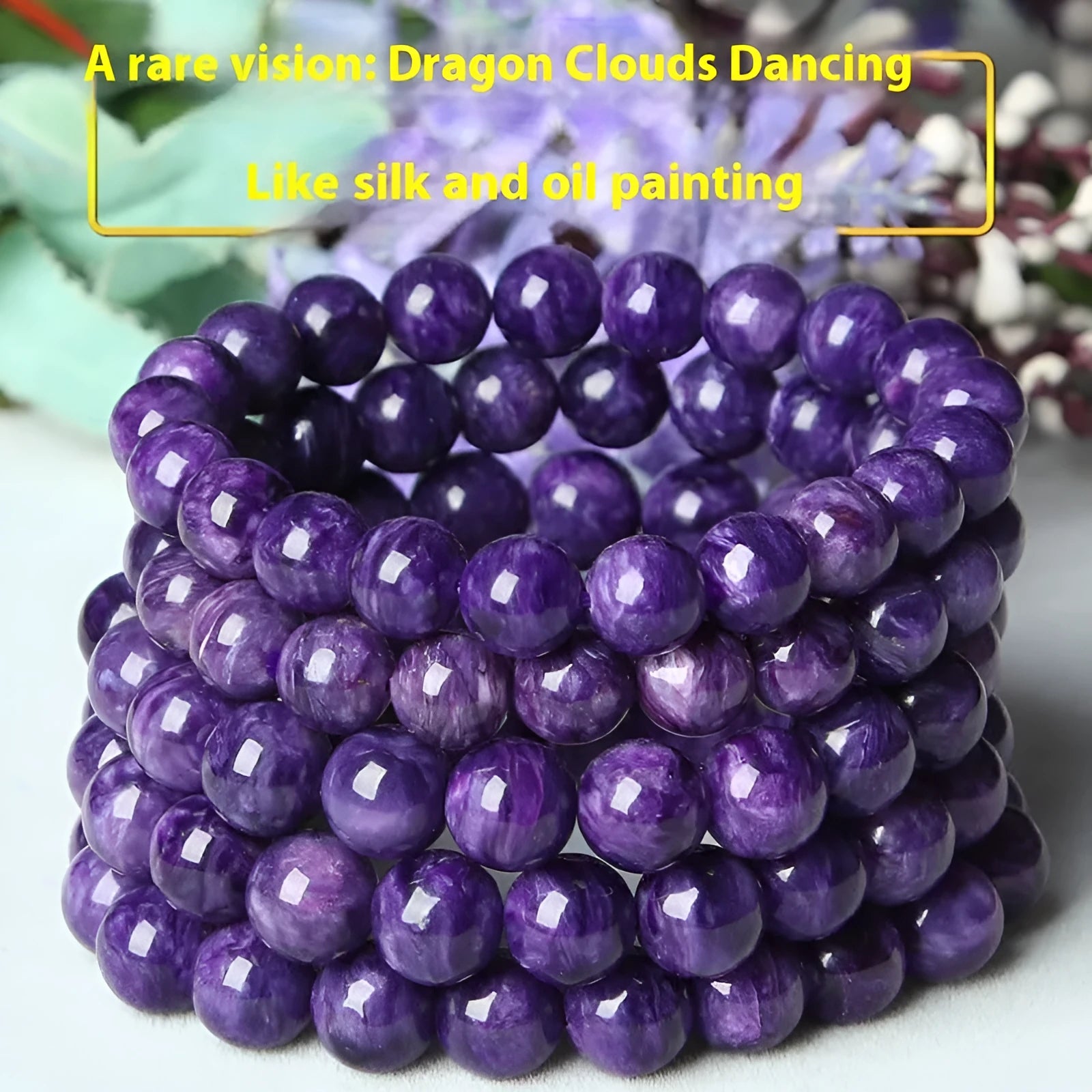 Transparent charoite crystal beaded bracelet with platinum-colour metal on a white background.
