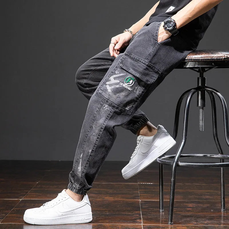 Man wearing loose blue cargo jeans with a straight leg and micro-elastic cotton fabric.