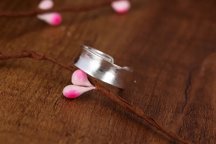 Geometric open ring with frosted sterling silver finish and adjustable opening design